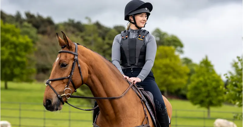 Rider on horse wearing a body protector